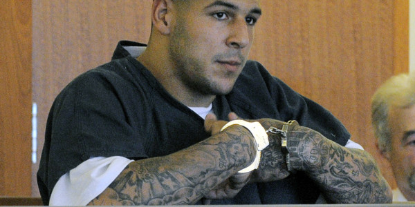 Aaron Hernandez cuffed for prison 2015