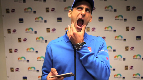 novak djokovic testing how wide his mouth goes for tennis balls 2015