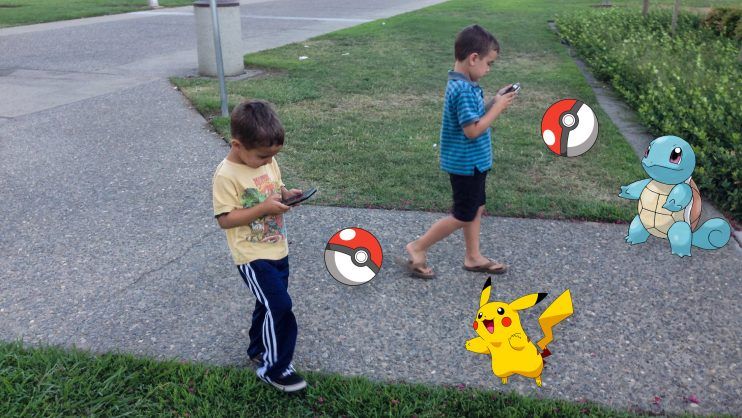 kids playing walking pokemon go
