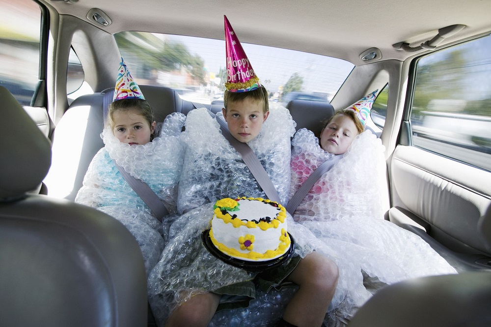 children wrapped in bubble wrap from overprotective parents