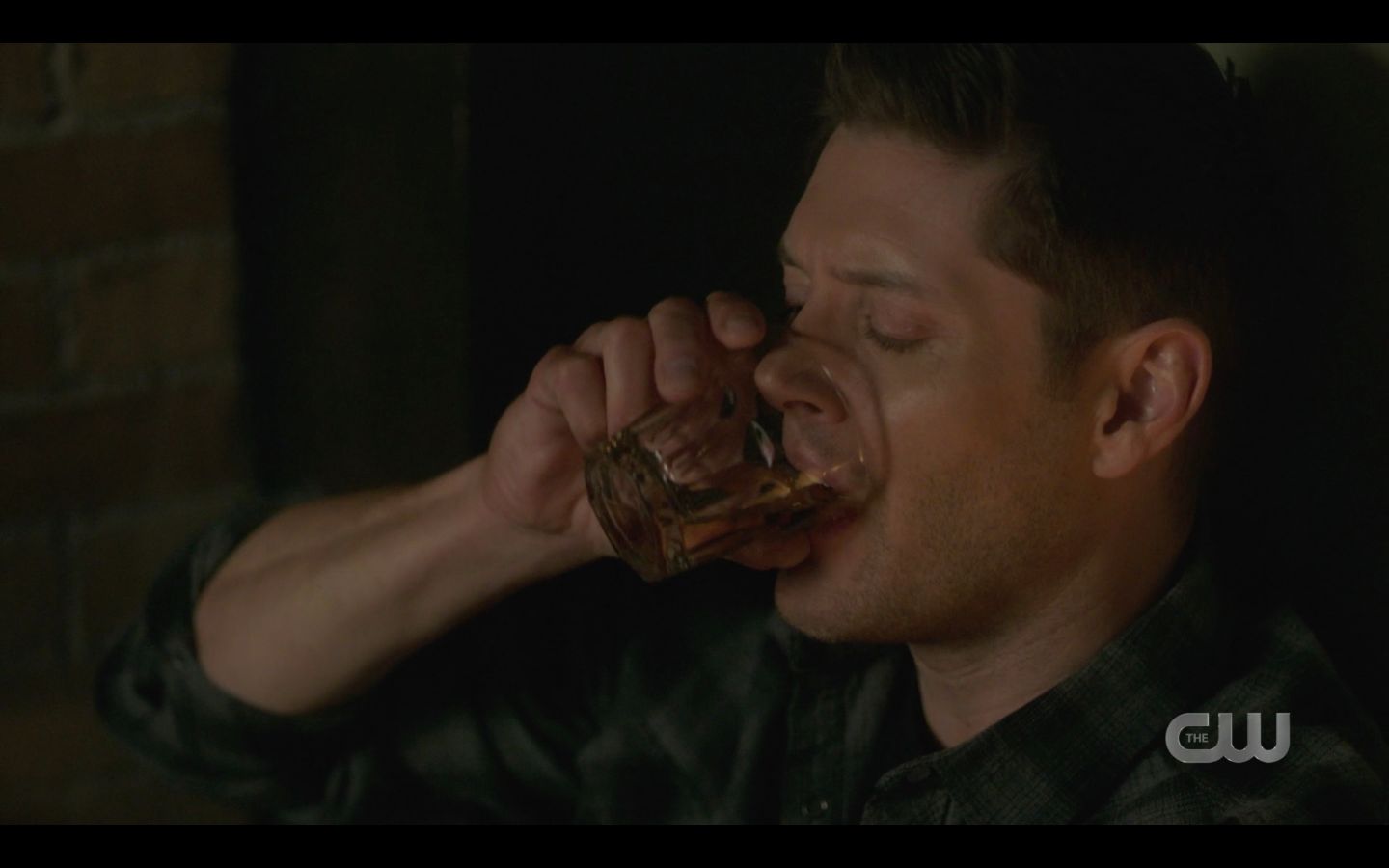 Dean Winchester taking a big slug of drink SPN 14 finale