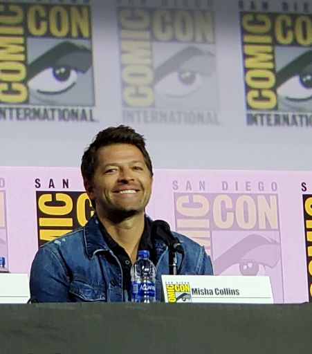 Misha Collins sitting down at Comic Con for Supernatural final panel 2019