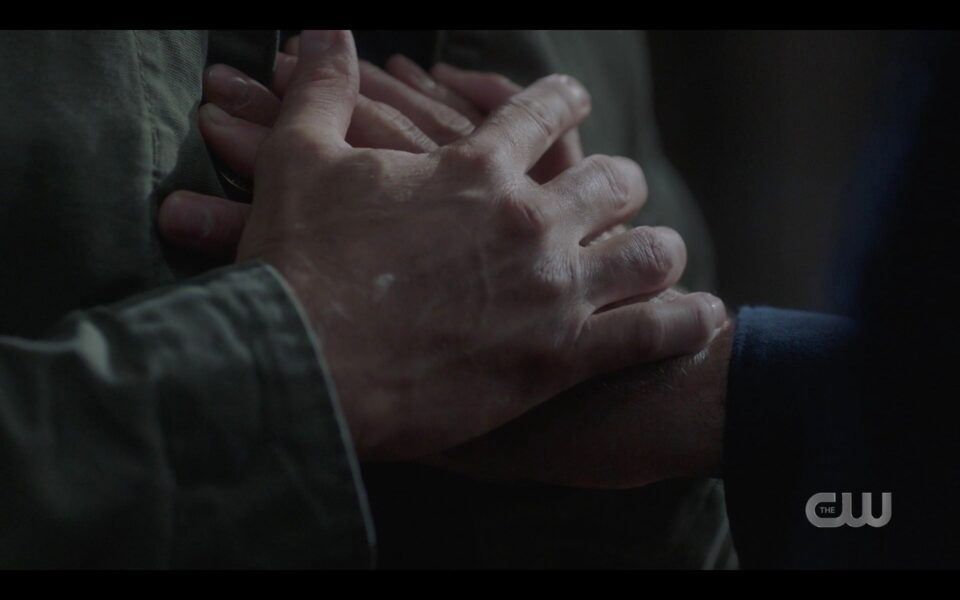 SPN Winchester brothers gripping hands as Dean dies