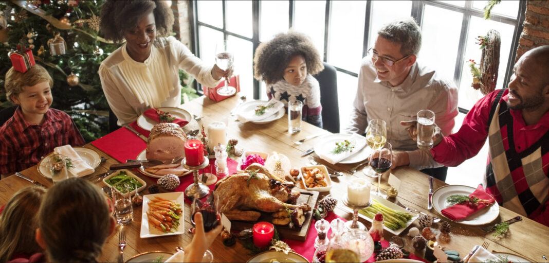 mixed family breaking from holiday traditions eating turkey 2020