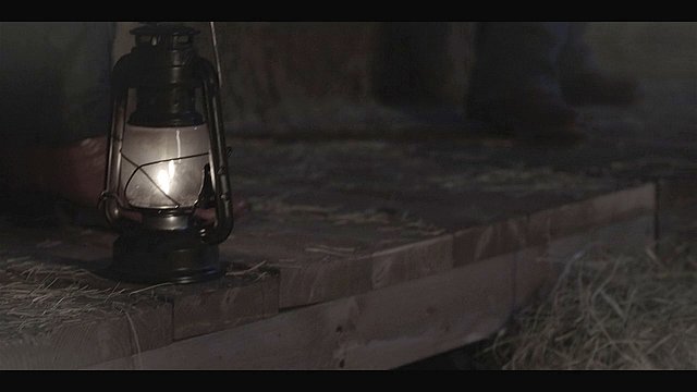 Walker opening scene of lit lantern about to burn down a barn killing people.