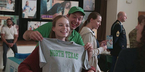 Walker STella with North Texas shirt at college fair day.