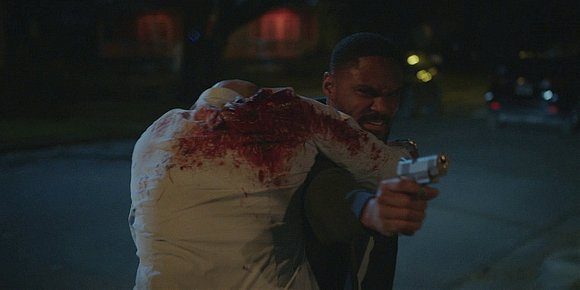 Trey running to return gunman's fire after finding James shot and bleeding on Walker.