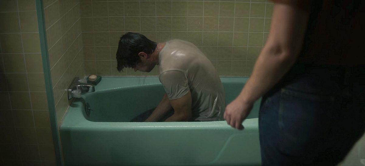 John Winchester soaking t shirt wet in tub sobbing over Vietnam War experience on Winchesters.
