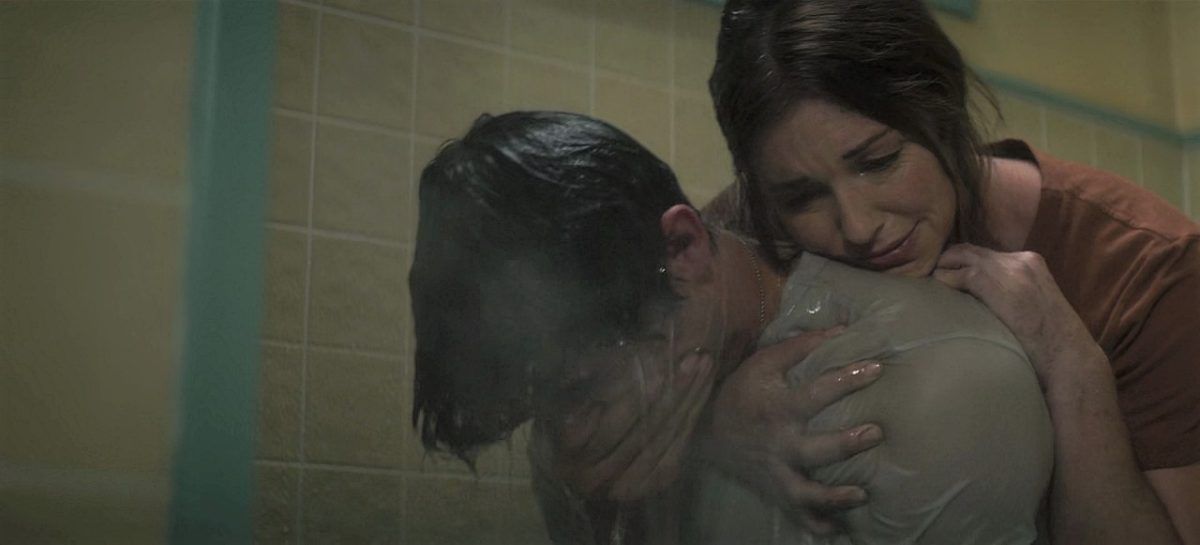 Mary Winchester Meg Donnelly holding Drake Rodger tight in bathtub as he sobs.