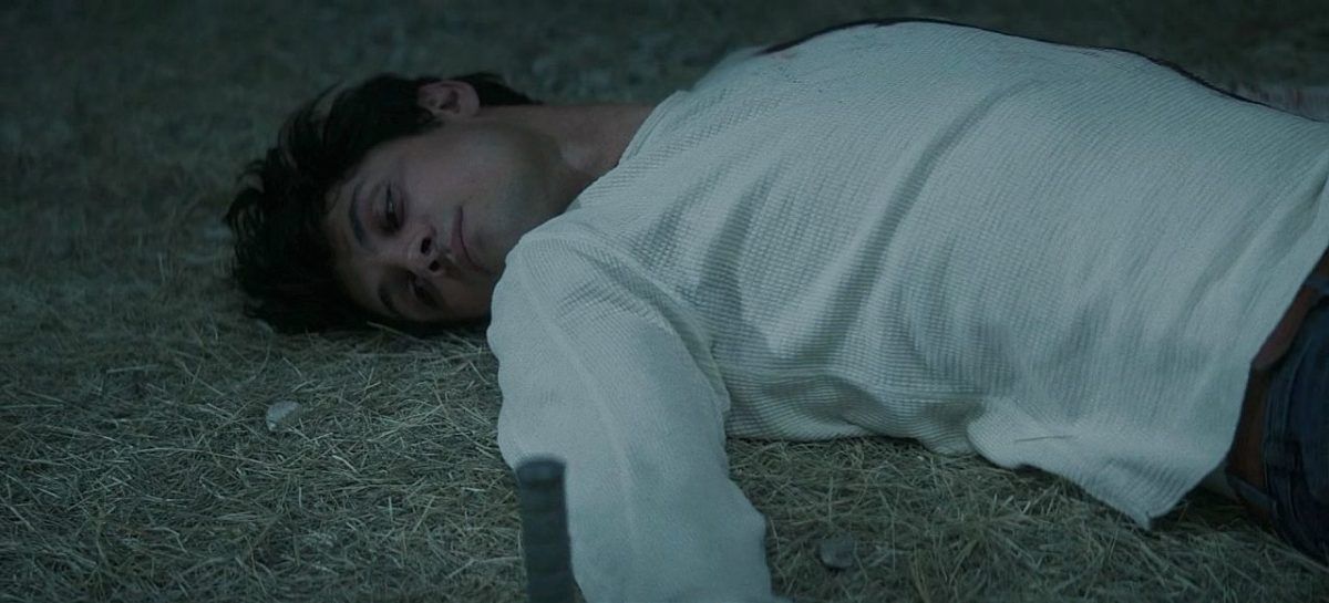 Drake Rodger laying on ground after demon penetrates infects him on The Winchesters.