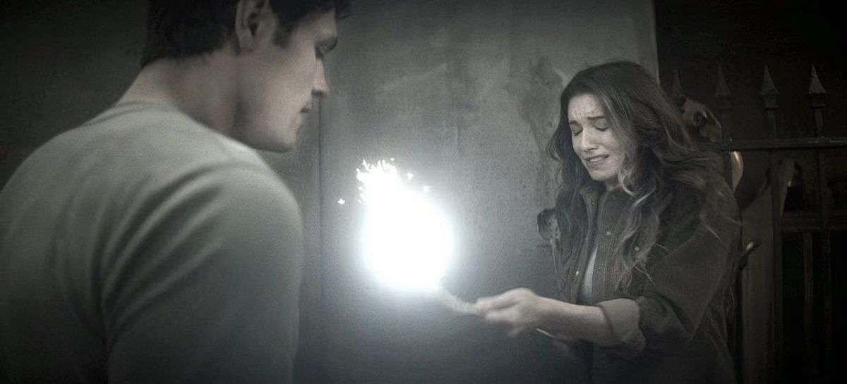 The Winchesters Millie shooting off fire in her hands for son John.