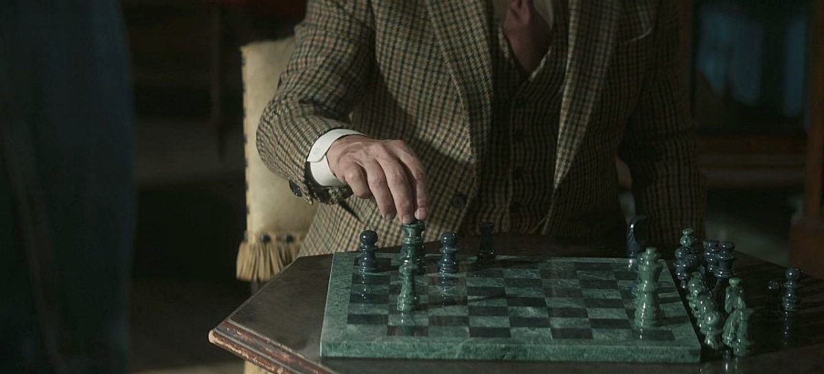 Jack Wilcox playing chess on The Winchesters.