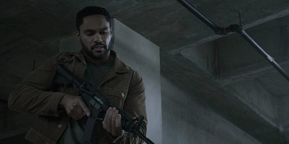 Walker Trey holding AK 47 on bad guy on cement floor 3.14.