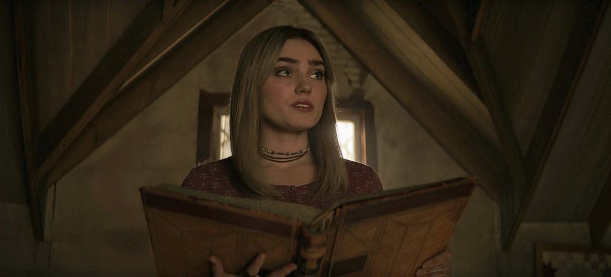 Mary Winchester reading from book of spells.