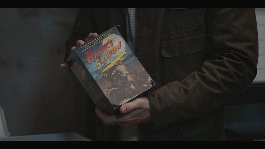 Liam showing Cassie a Hawk's Shadow DVD
