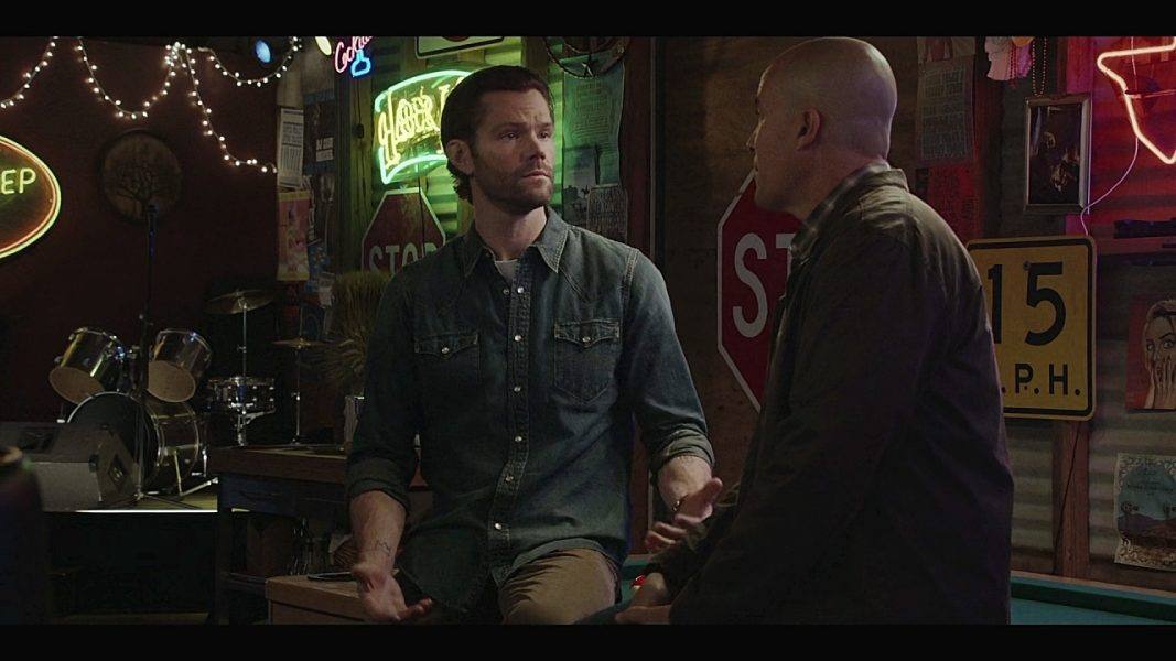 Jared Padalecki feeling up the bar with Coby Bell on Walker set 4.04.