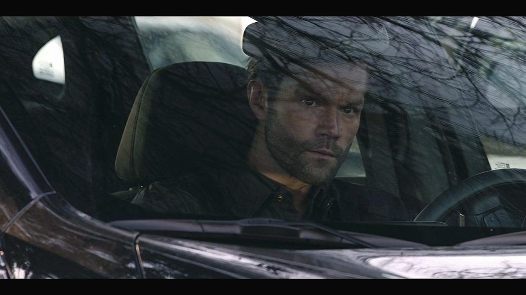 Jared Padalecki looking through windshield on Walker set.