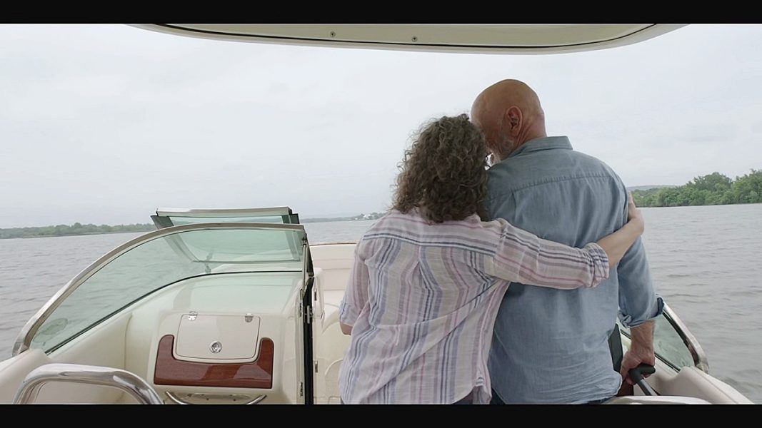 Abilene hugging Bonham on boat.